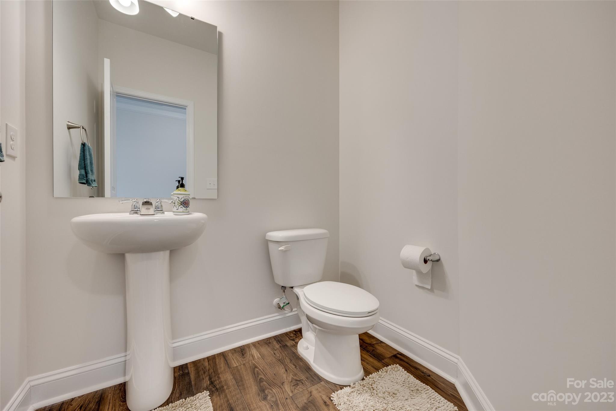 8013 Oakmere Road Waxhaw, NC 28173 - Photo 7 of 30 a bathroom with a sink toilet and a mirror