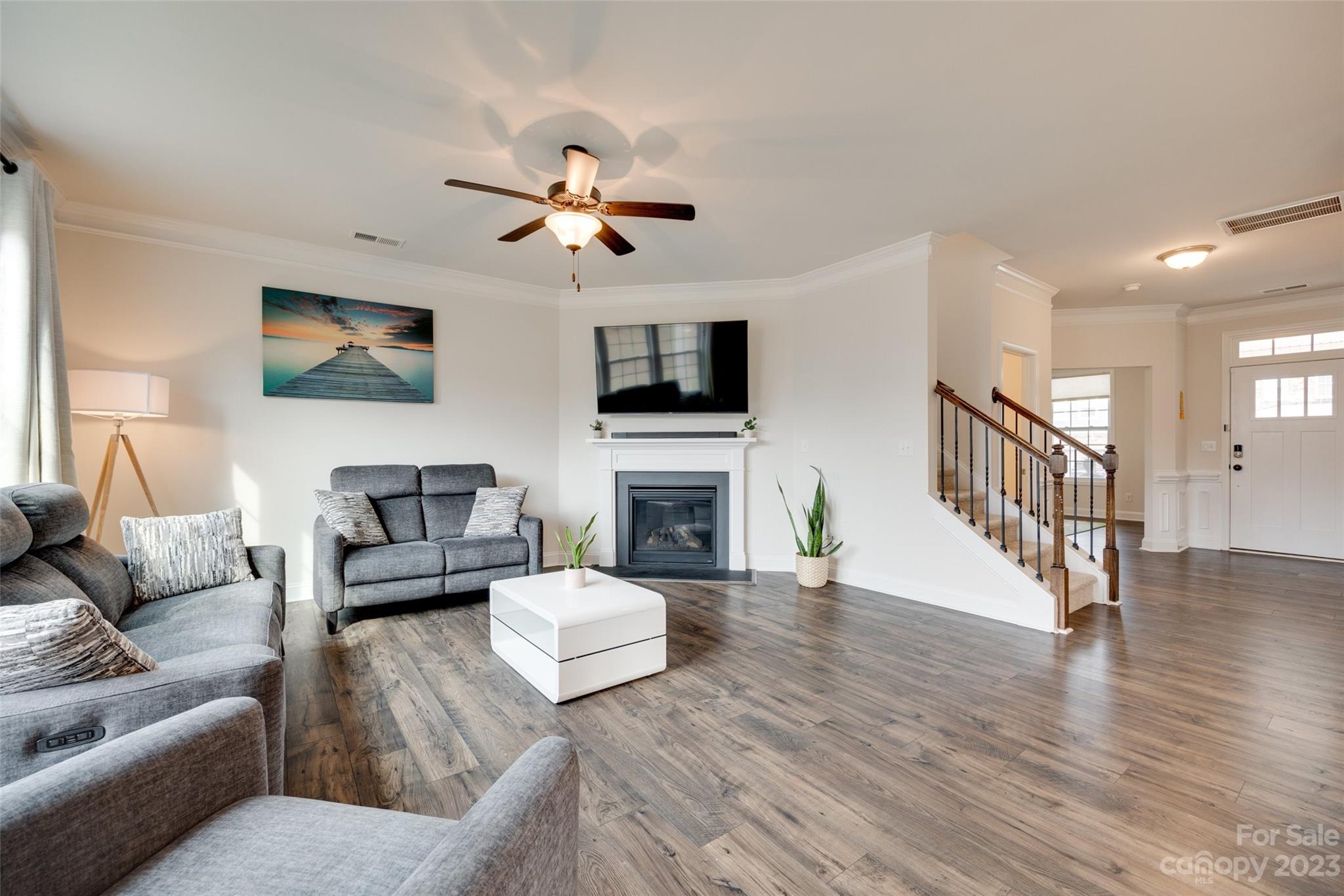8013 Oakmere Road Waxhaw, NC 28173 - Photo 9 of 30 a living room with furniture a fireplace and a flat screen tv