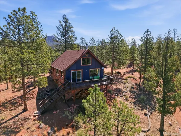 a house with trees in the background