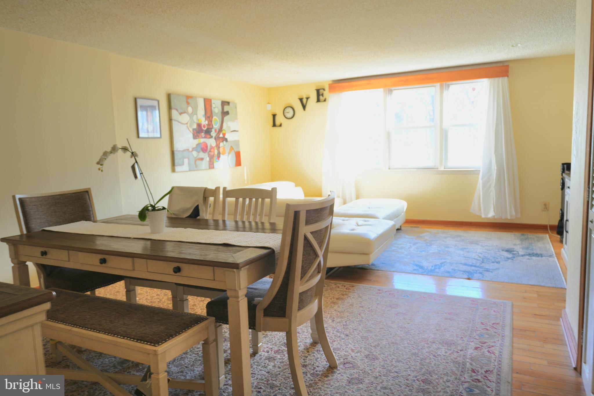 9274 Angus Place Philadelphia, PA 19114 - Photo 5 of 10 a view of a dining room with furniture and a window