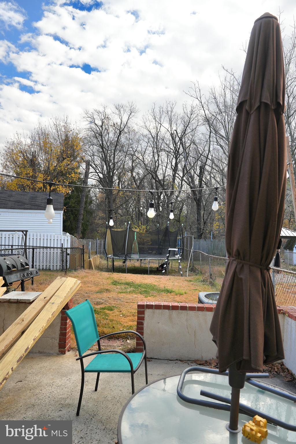 9274 Angus Place Philadelphia, PA 19114 - Photo 10 of 10 a swimming pool with outdoor seating and yard