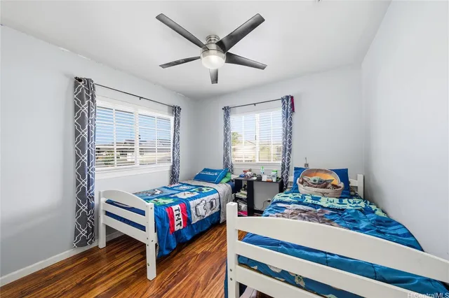 a bedroom with bed and a window