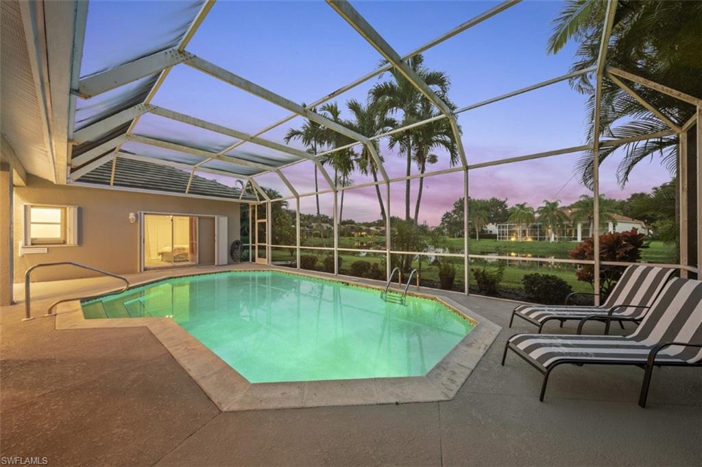 11774 Longshore Way West Naples, FL 34119 - Photo 29 of 35 a view of swimming pool with a patio