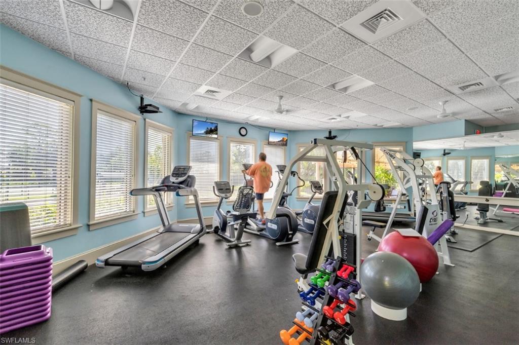 11774 Longshore Way West Naples, FL 34119 - Photo 33 of 35 a room with gym equipment and a large window