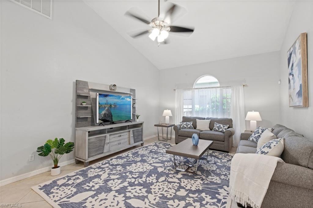 11774 Longshore Way West Naples, FL 34119 - Photo 10 of 35 a living room with furniture and a flat screen tv