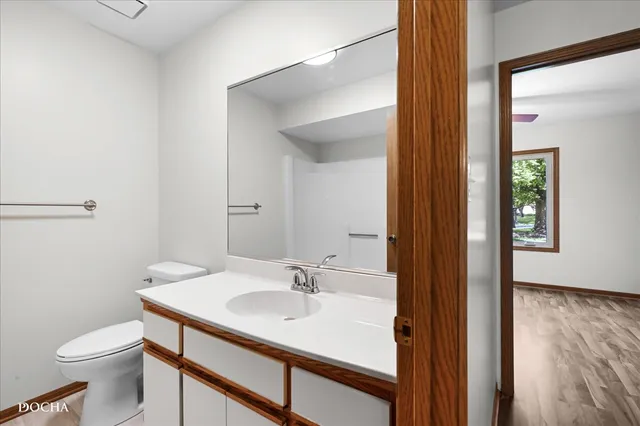 a bathroom with a sink toilet and vanity