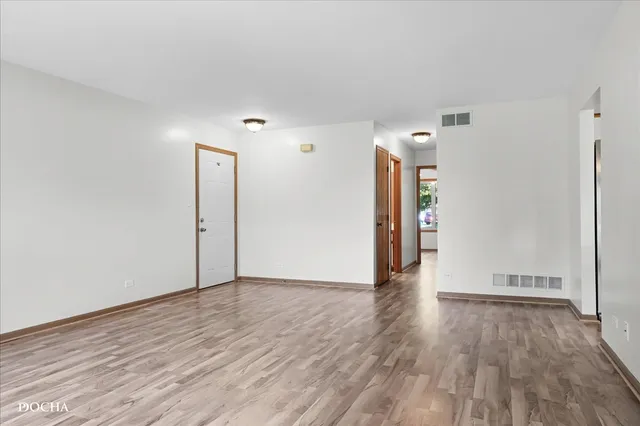 a view of a livingroom with wooden floor