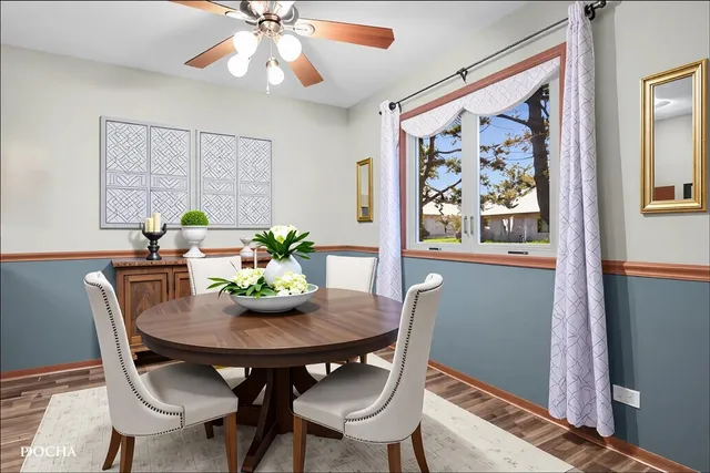 a view of a dining room with furniture window and wooden floor