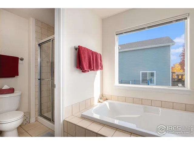 a bathroom with a toilet sink and shower