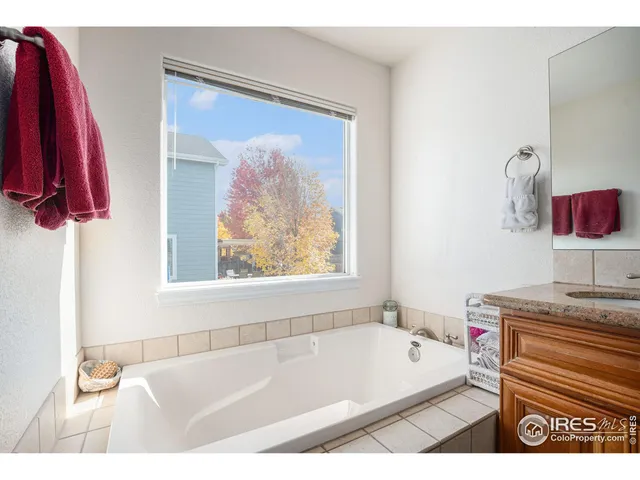 a bathroom with a bath tub and a shower curtain