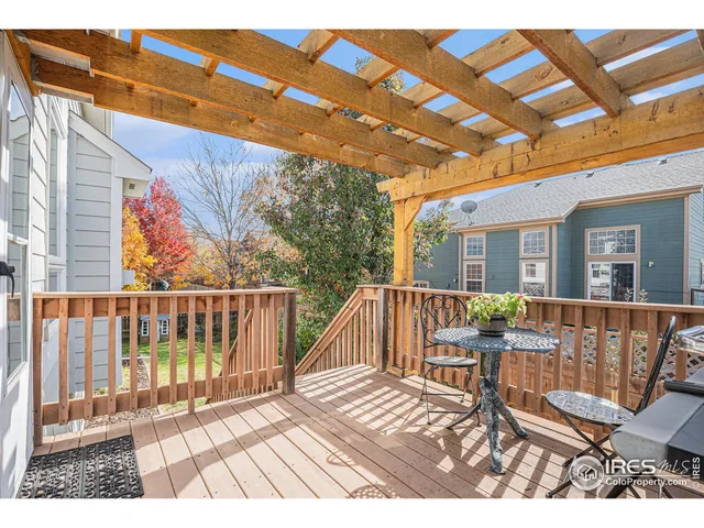 a view of balcony with wooden floor and outdoor seating
