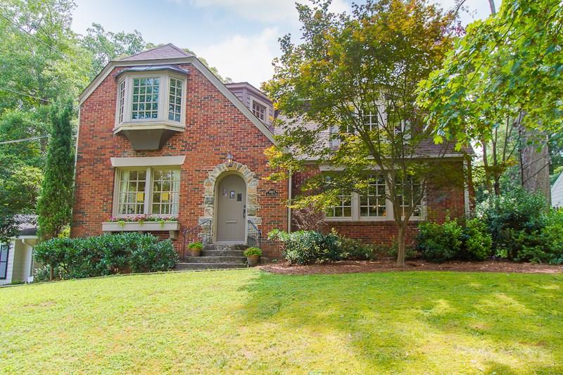 1865 Anjaco Road Northwest Atlanta, GA 30309 - Photo 1 of 1 a front view of a house with a yard