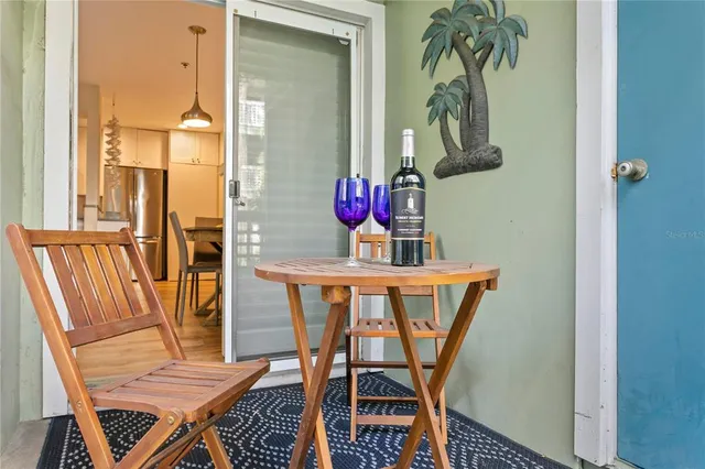 a view of a dining room with furniture and a potted plant