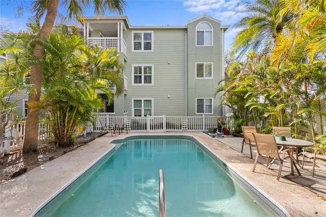 a house with swimming pool in front of it