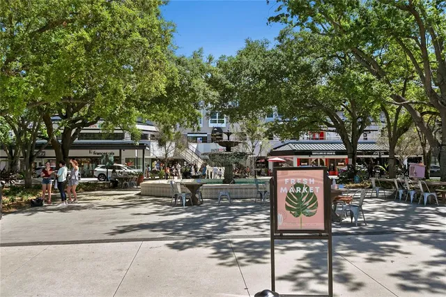 a front view of a building with trees