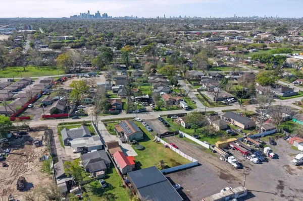 an aerial view of residential houses with outdoor space