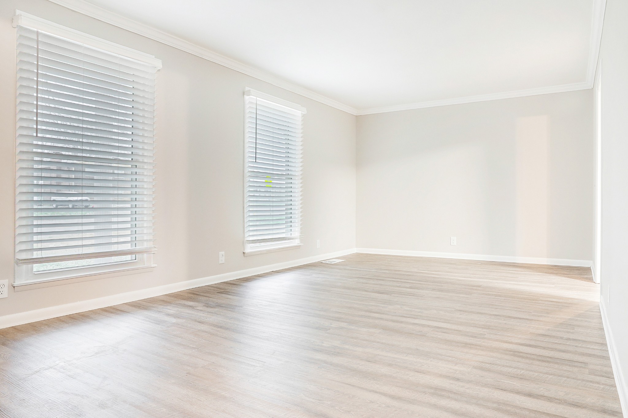 1320 Cheyenne Boulevard Madison, TN 37115 - Photo 18 of 26 a view of an empty room with wooden floor and a window