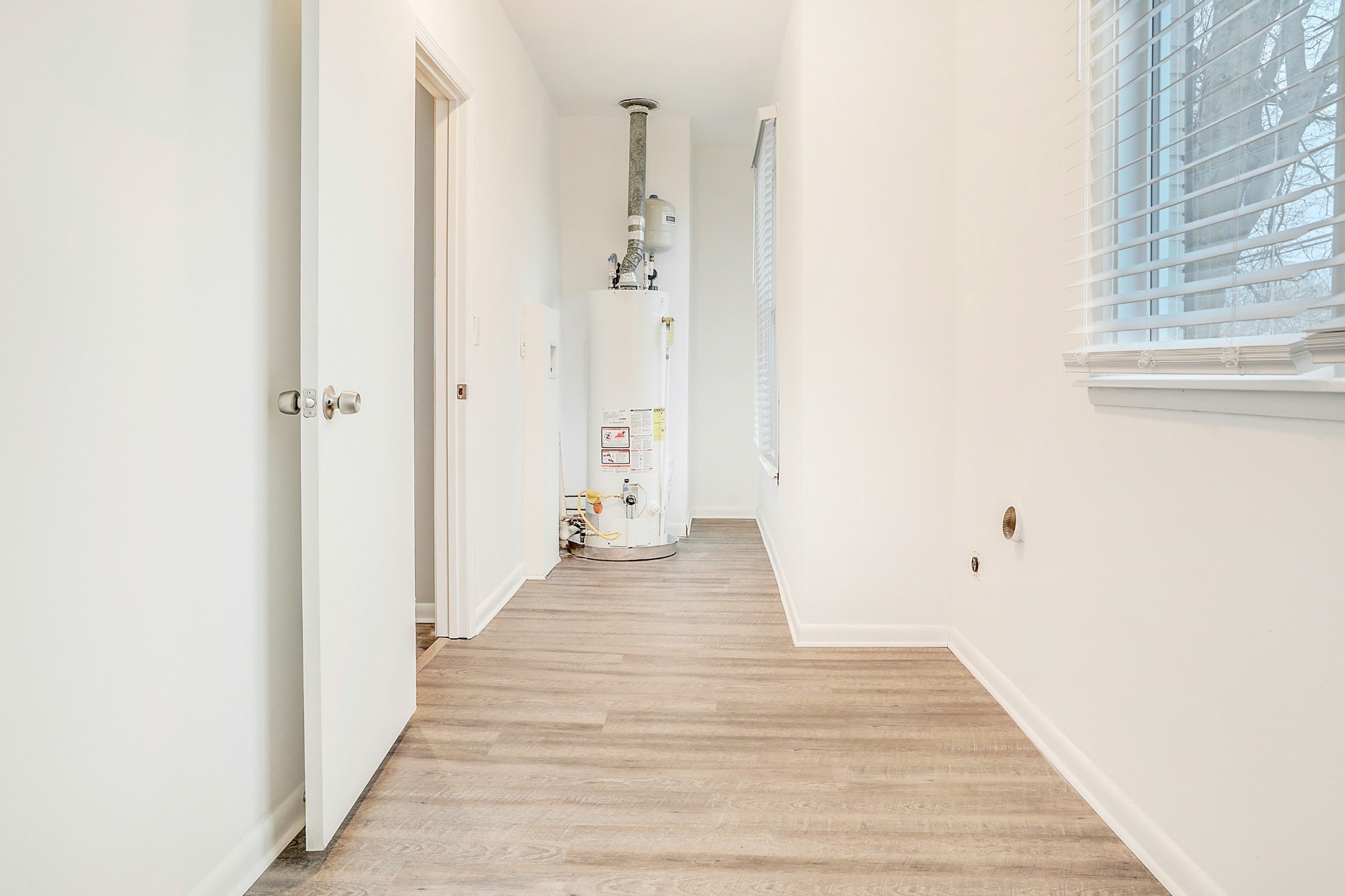 1320 Cheyenne Boulevard Madison, TN 37115 - Photo 23 of 26 a view of a hallway with wooden floor and a bathroom