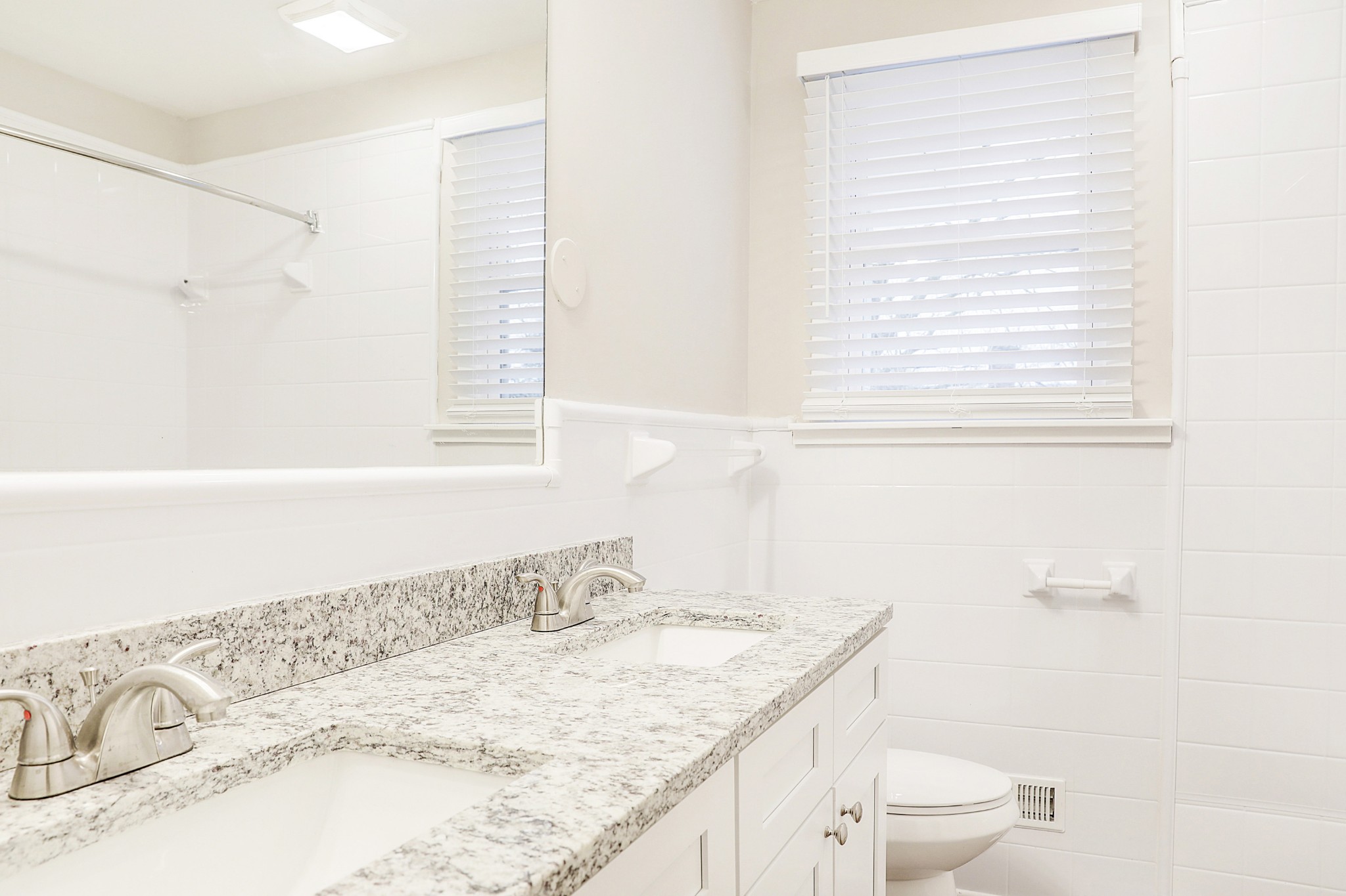 1320 Cheyenne Boulevard Madison, TN 37115 - Photo 8 of 26 a bathroom with a granite countertop sink a toilet and a bathtub
