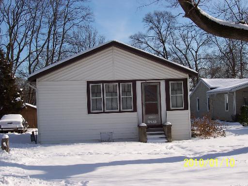 14427 Ridgeway Avenue Midlothian, IL 60445 - Photo 1 of 1 a view of a house with snow