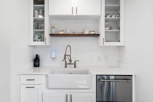 a bathroom with a sink and a window