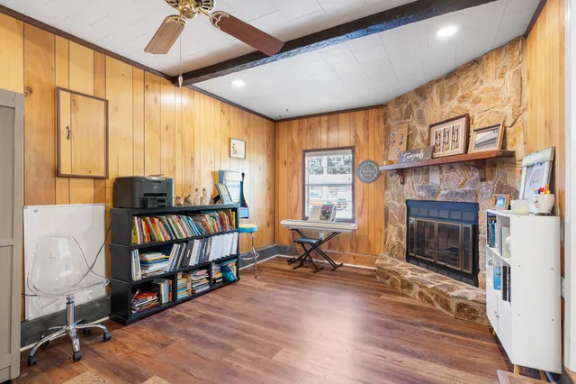 a view of a livingroom with furniture and a fireplace