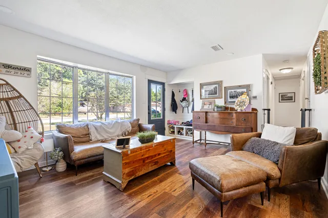 a living room with furniture and a large window