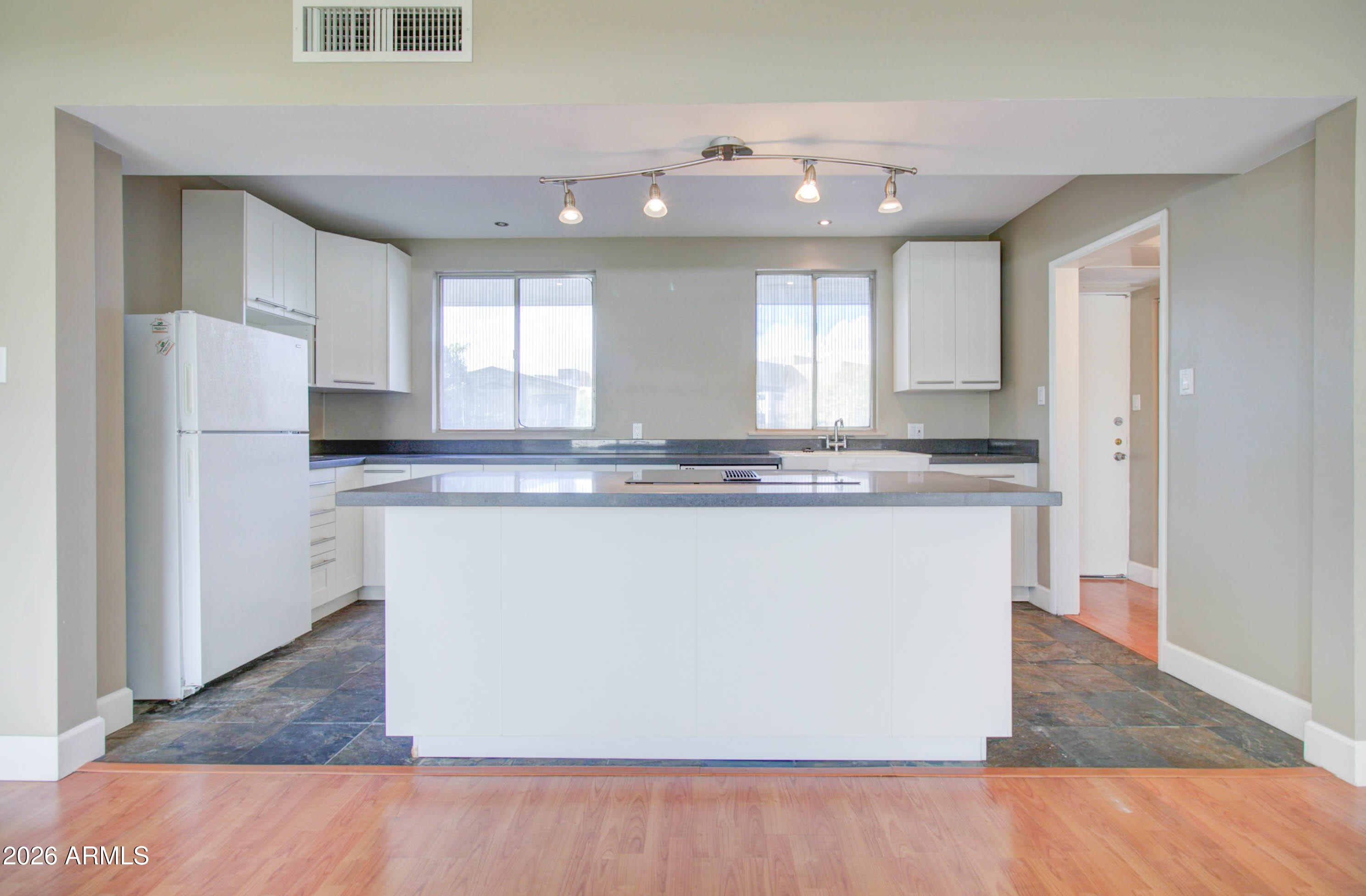 3242 East Camelback Road, Unit 207 Phoenix, AZ 85018 - Photo 10 of 25 Kitchen w/ White Shaker Cabinetry