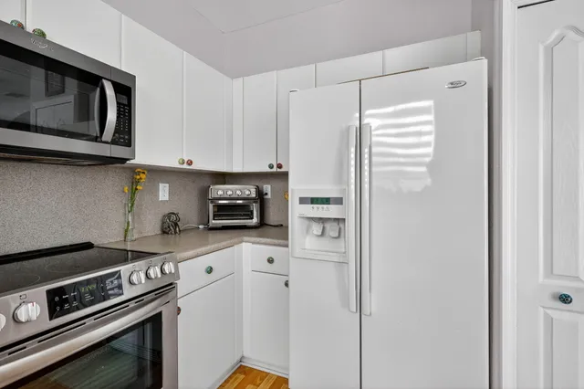 a room with gym equipment and a flat screen tv