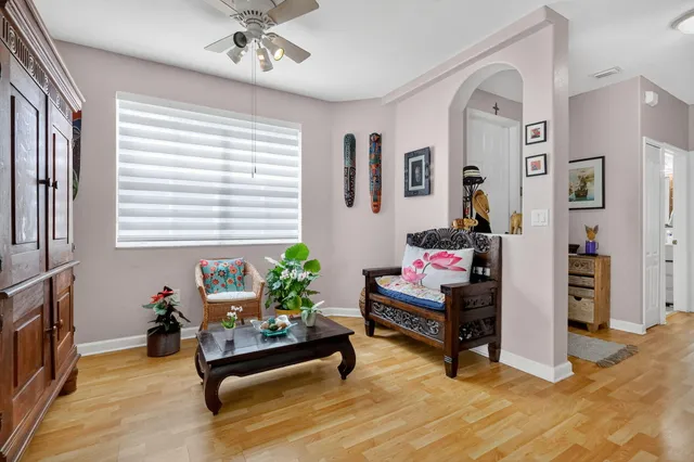 a bathroom with a granite countertop sink a mirror and shower