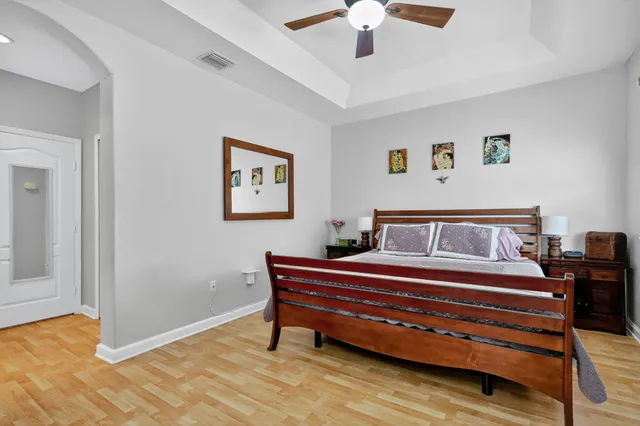 a bedroom with a bed and a desk