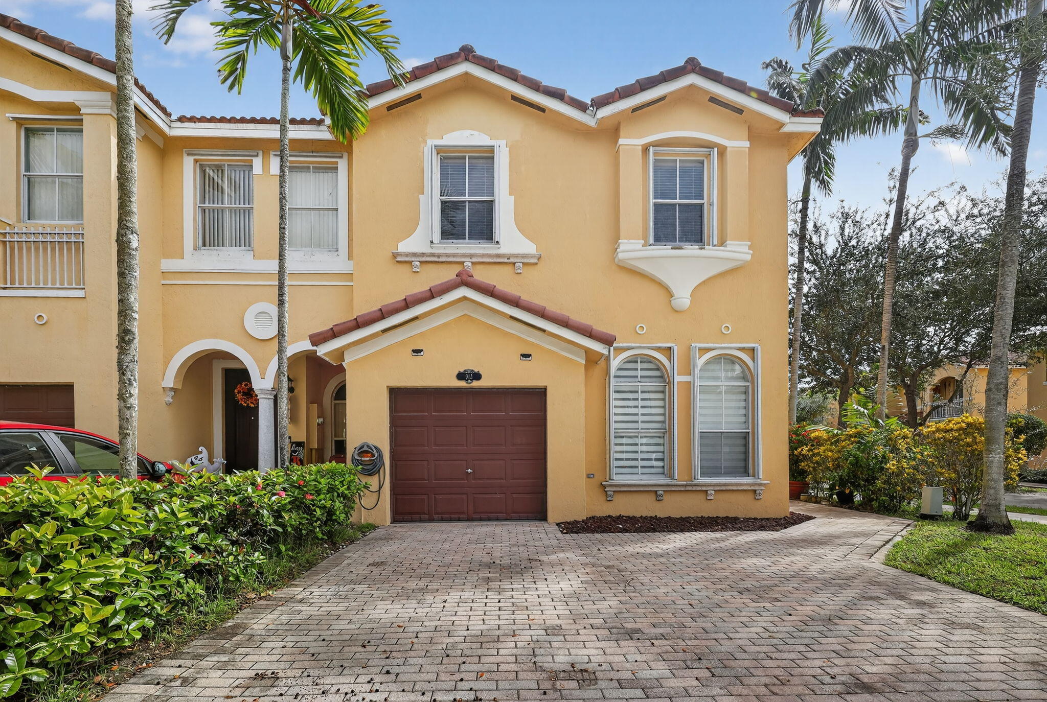 913 Southwest 151 Place Miami, FL 33194 - Photo 3 of 48 front view of a house with a yard