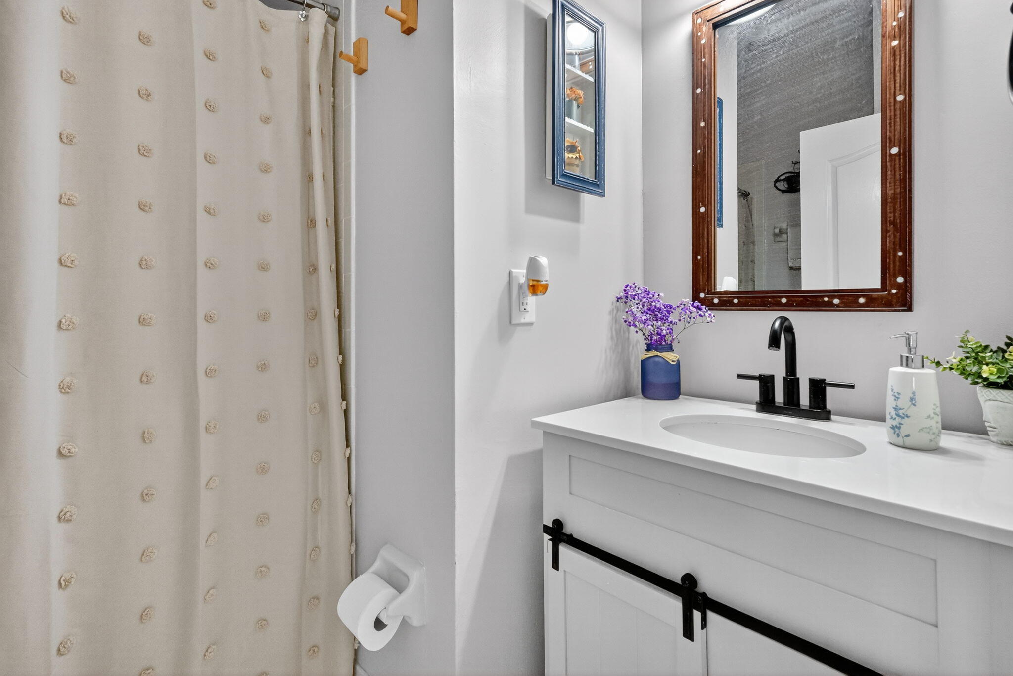 913 Southwest 151 Place Miami, FL 33194 - Photo 31 of 48 a bathroom with a sink vanity and mirror