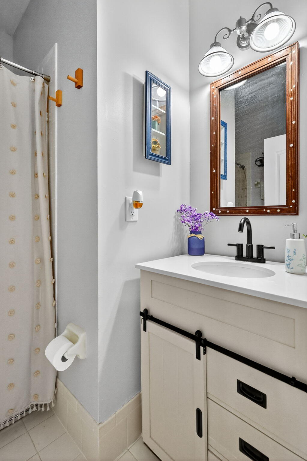 913 Southwest 151 Place Miami, FL 33194 - Photo 32 of 48 a bathroom with a sink and a mirror