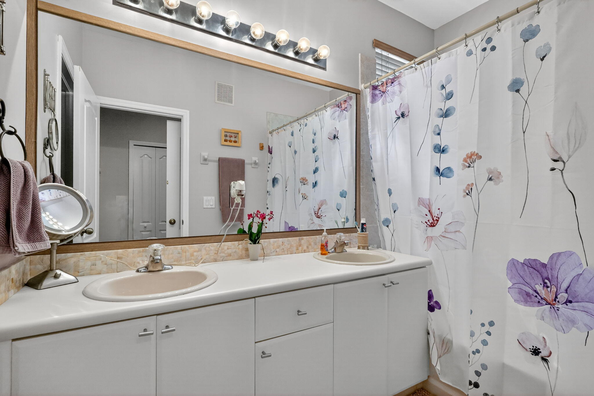 913 Southwest 151 Place Miami, FL 33194 - Photo 36 of 48 a bathroom with a double vanity sink mirror and double