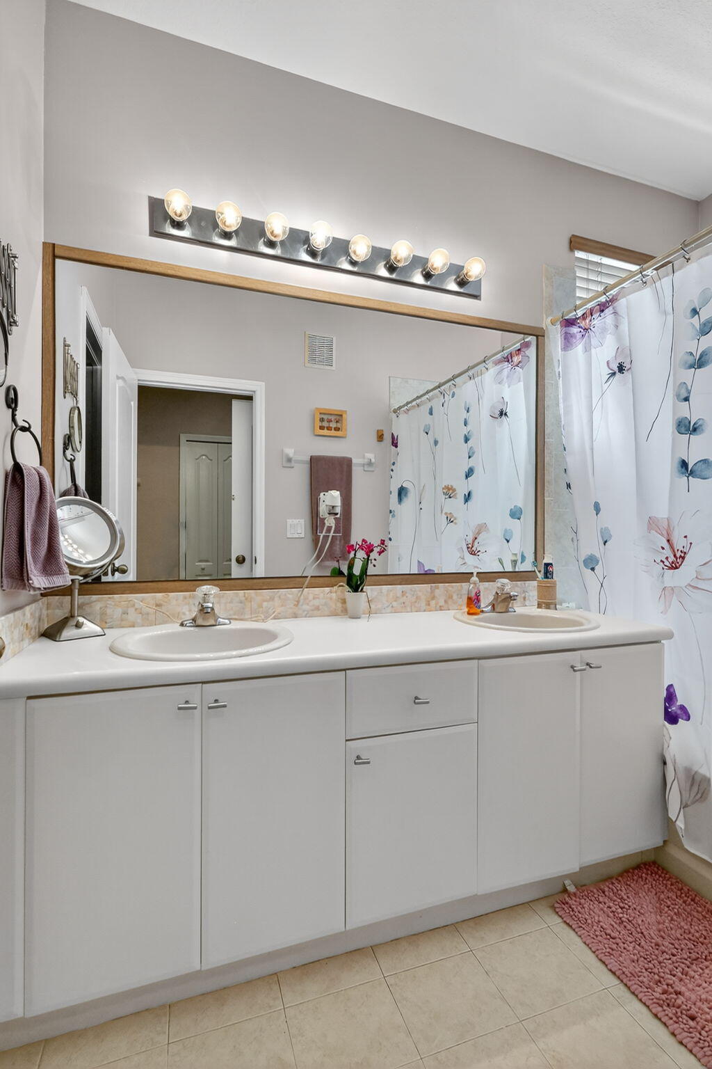 913 Southwest 151 Place Miami, FL 33194 - Photo 37 of 48 a bathroom with a sink and a mirror