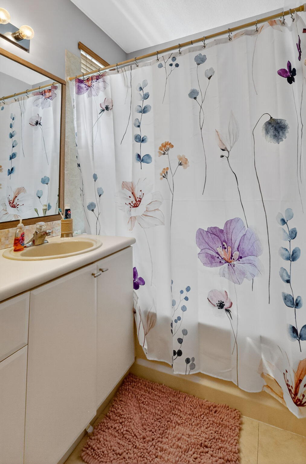 913 Southwest 151 Place Miami, FL 33194 - Photo 38 of 48 a bathroom with a granite countertop sink a mirror and shower