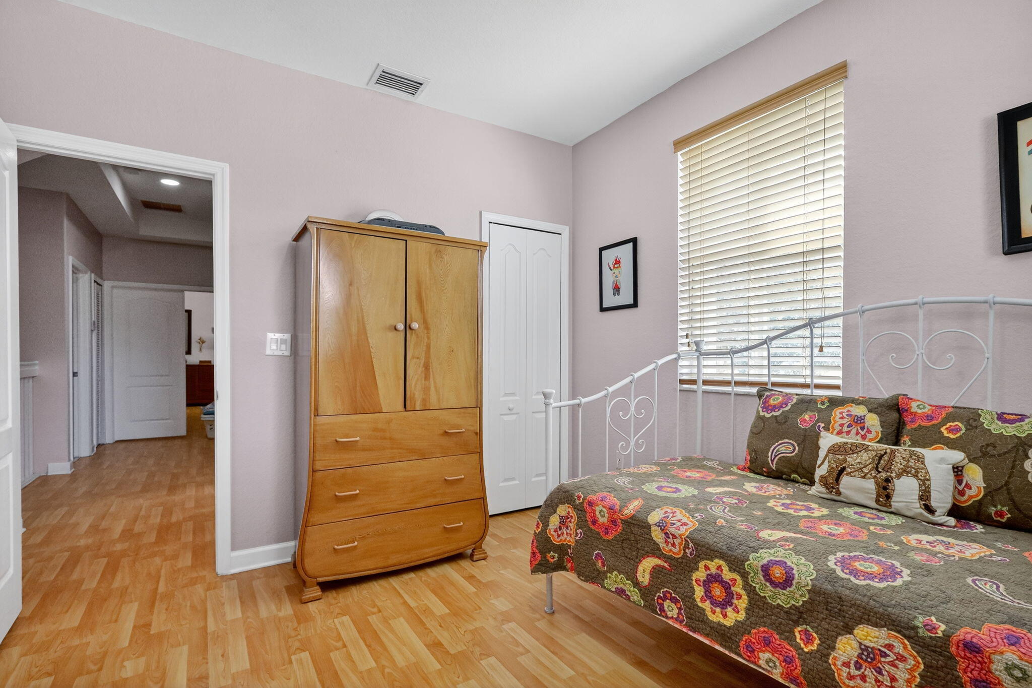 913 Southwest 151 Place Miami, FL 33194 - Photo 43 of 48 a bedroom with a bed and wooden floor