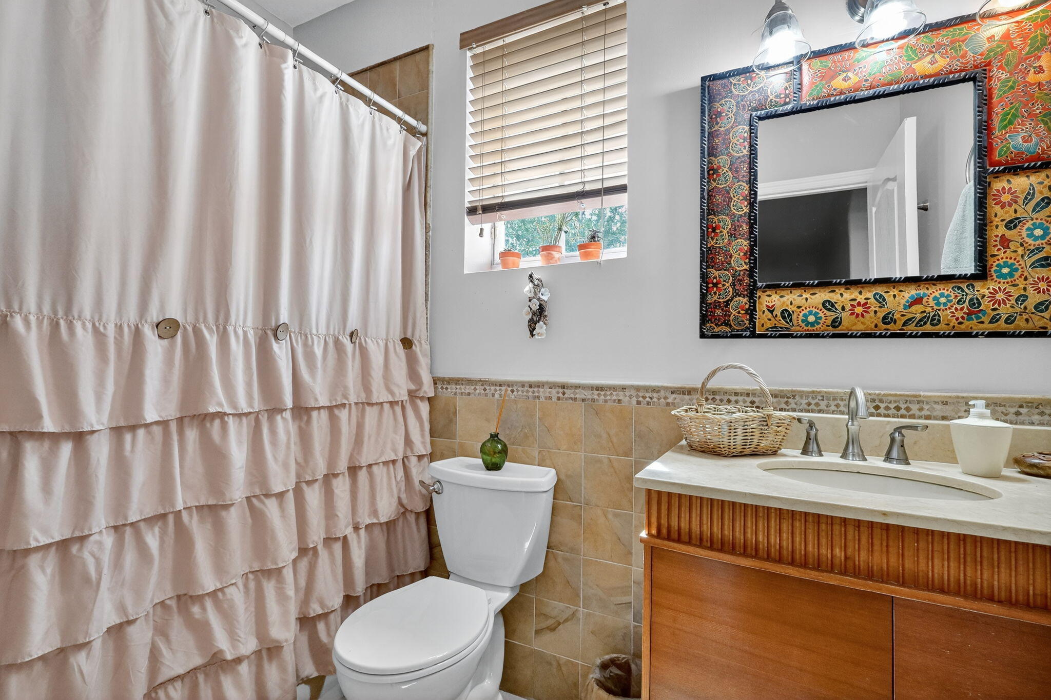 913 Southwest 151 Place Miami, FL 33194 - Photo 44 of 48 a bathroom with a toilet a sink and a mirror