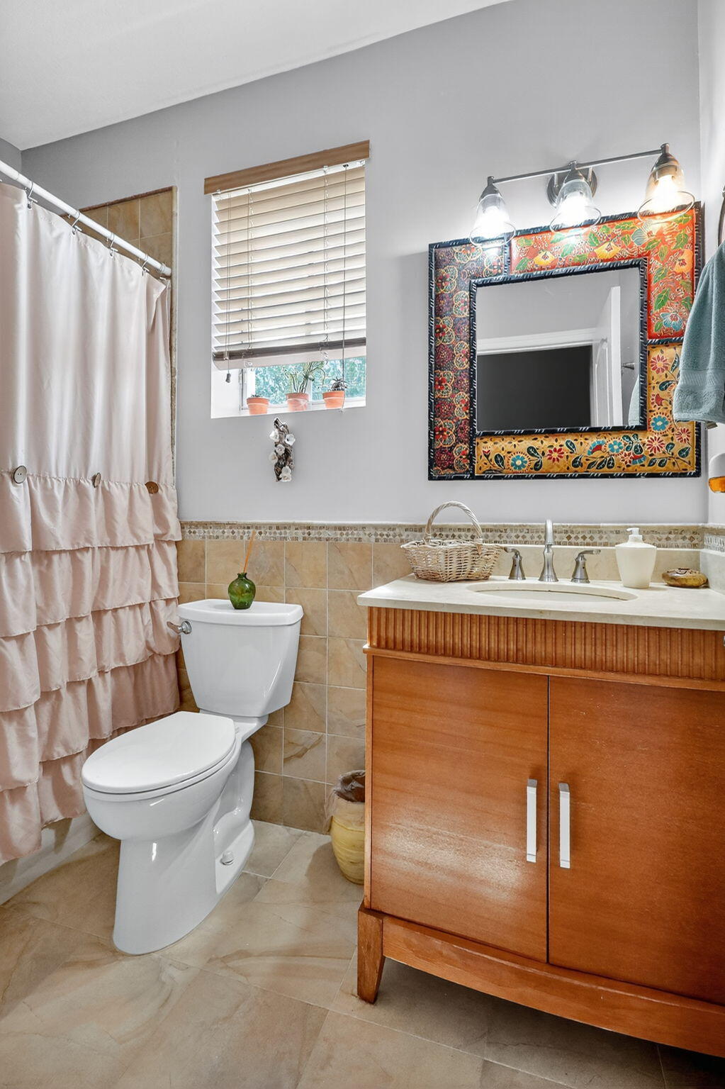 913 Southwest 151 Place Miami, FL 33194 - Photo 45 of 48 a bathroom with a toilet a sink and a mirror