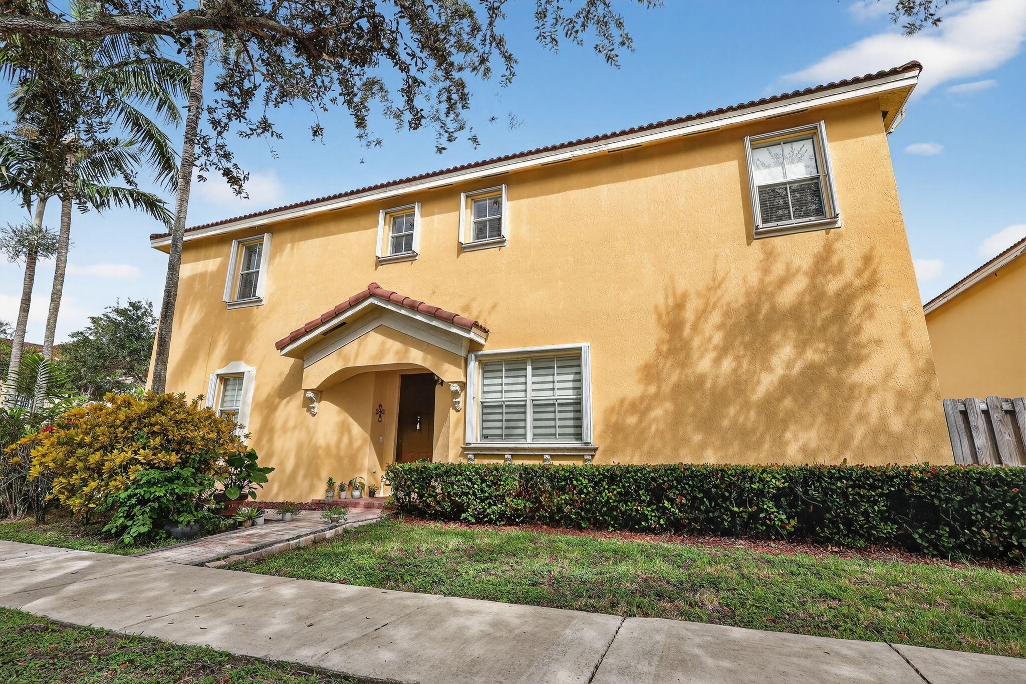 913 Southwest 151 Place Miami, FL 33194 - Photo 6 of 48 a front view of a house with a yard