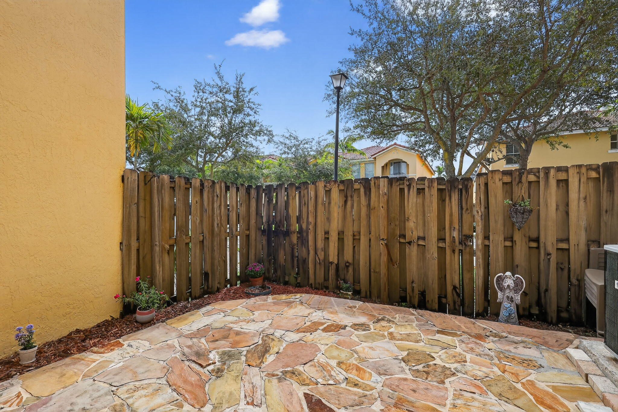 913 Southwest 151 Place Miami, FL 33194 - Photo 9 of 48 a view of a covered with wooden fence