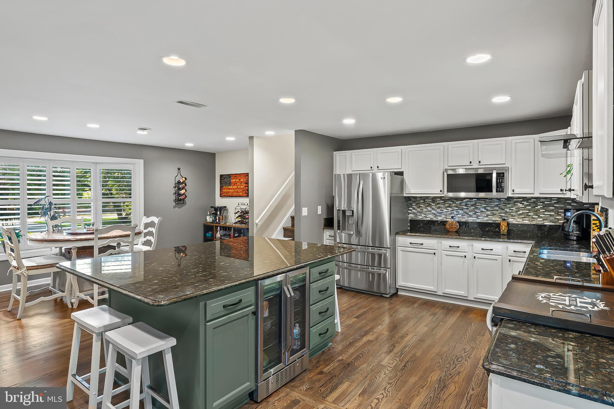 1811 Underwood Road Gambrills, MD 21054 - Photo 19 of 46 a kitchen with stainless steel appliances granite countertop a sink stove and refrigerator
