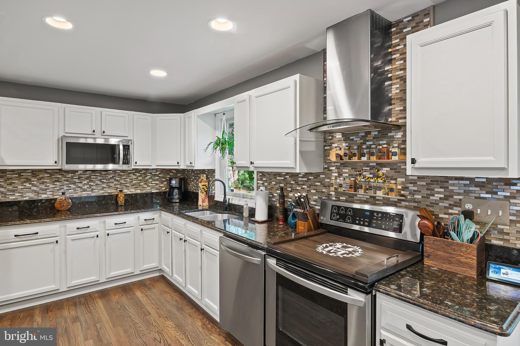 1811 Underwood Road Gambrills, MD 21054 - Photo 21 of 46 a kitchen with stainless steel appliances granite countertop a stove sink and cabinets