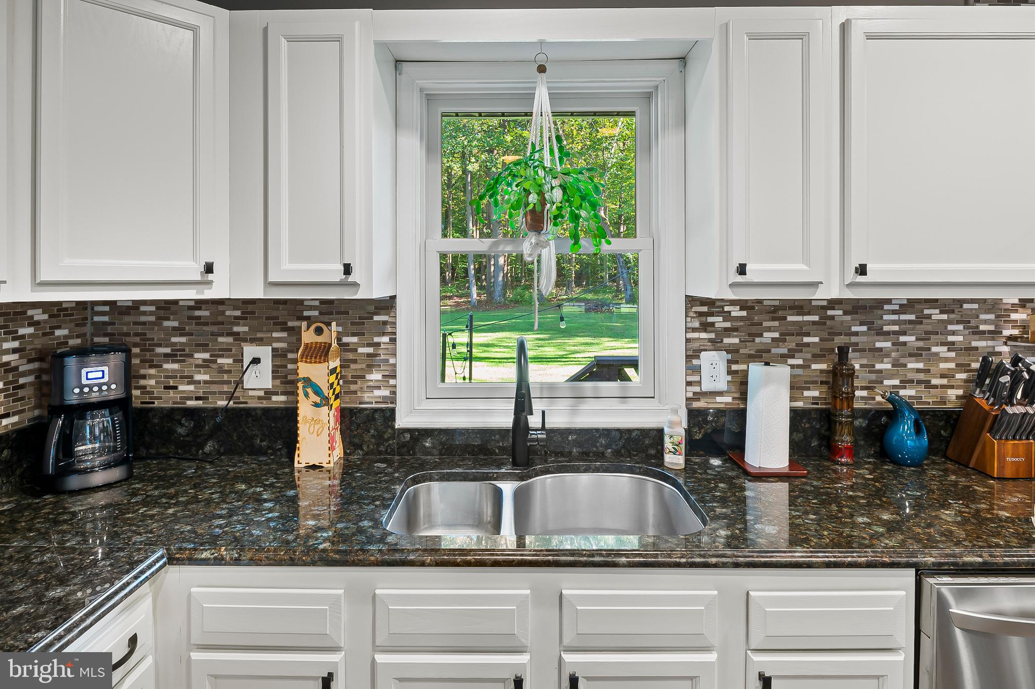 1811 Underwood Road Gambrills, MD 21054 - Photo 22 of 46 a kitchen with granite countertop white cabinets and a window