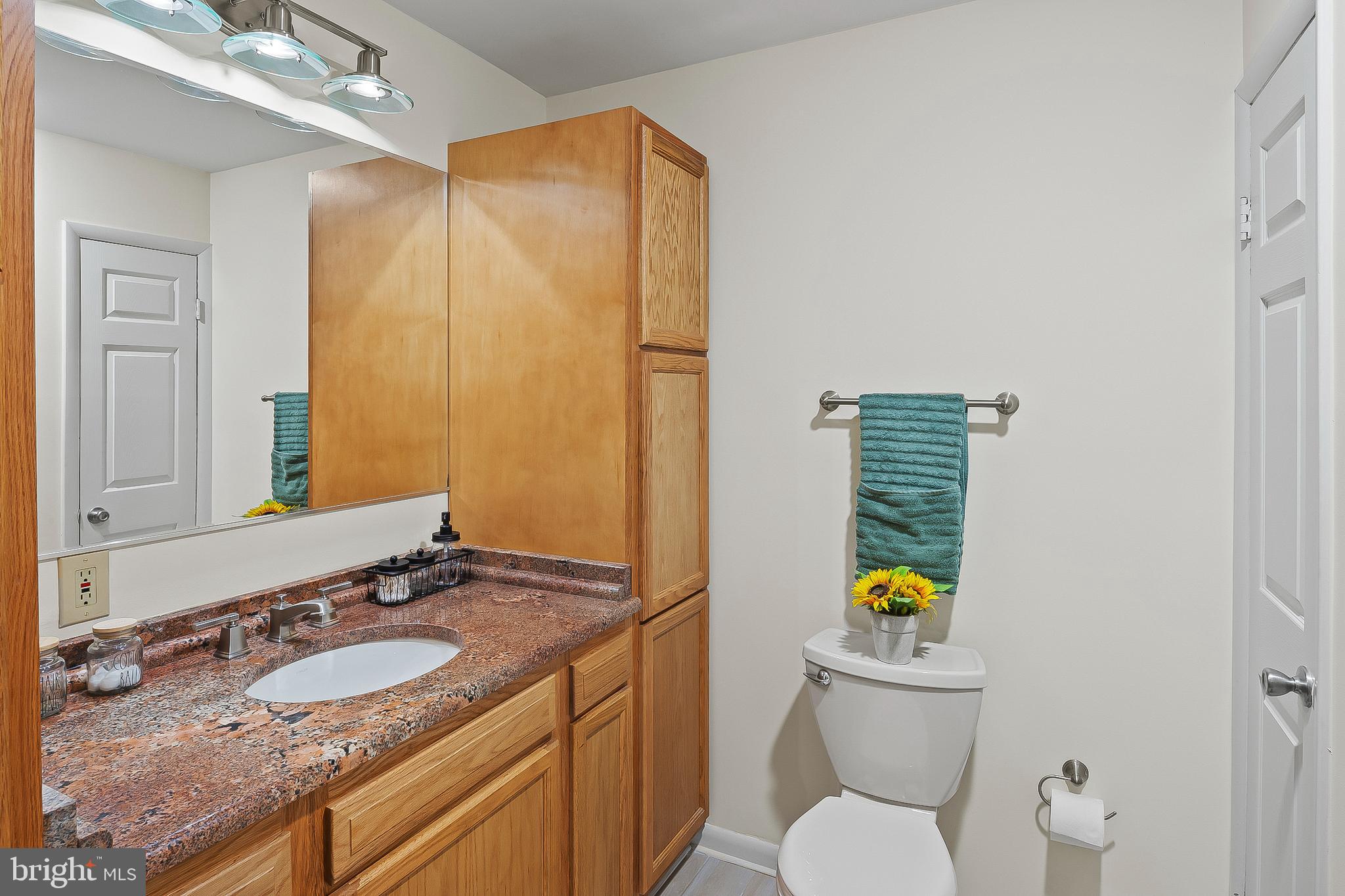 1811 Underwood Road Gambrills, MD 21054 - Photo 27 of 46 a bathroom with a granite countertop sink and a mirror