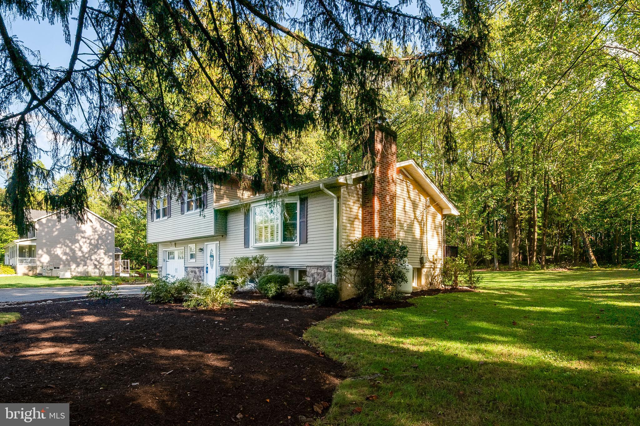 1811 Underwood Road Gambrills, MD 21054 - Photo 5 of 46 a front view of a house with a yard and tree s