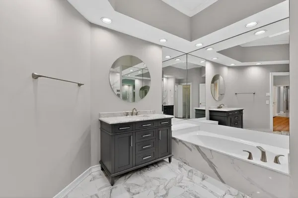 a spacious bathroom with a double vanity sink double and mirror