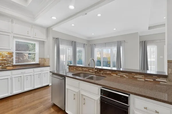 a view of a large counter space and windows in a room