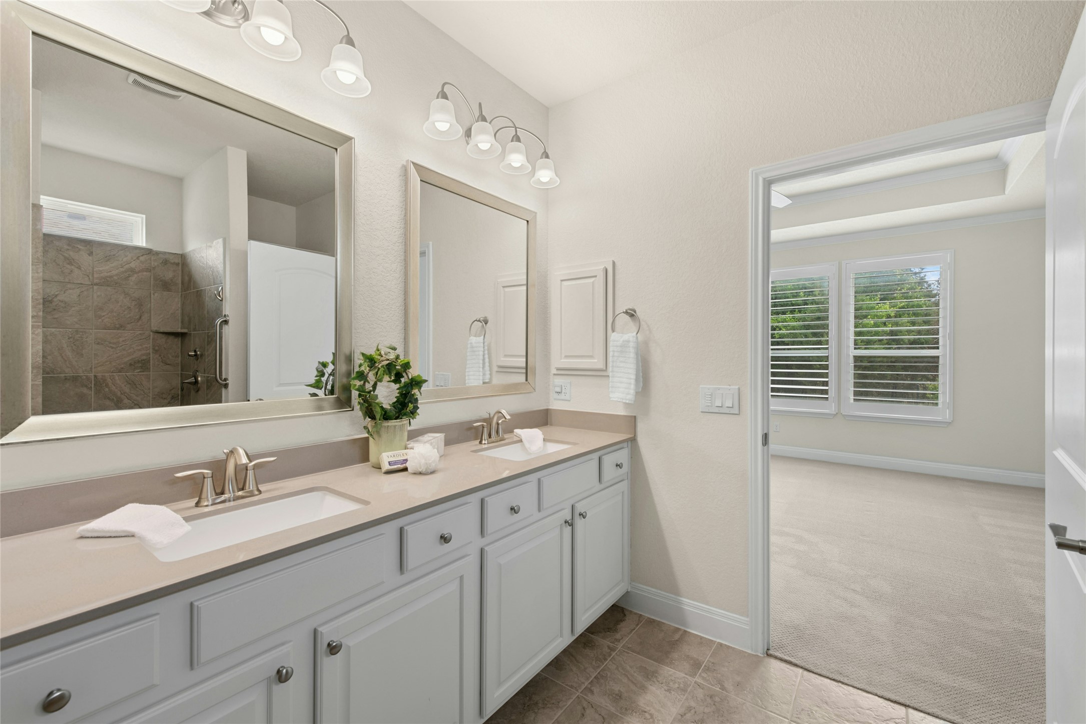 105 Marfa Cove Georgetown, TX 78633 - Photo 20 of 36 a bathroom with a granite countertop sink double and mirror